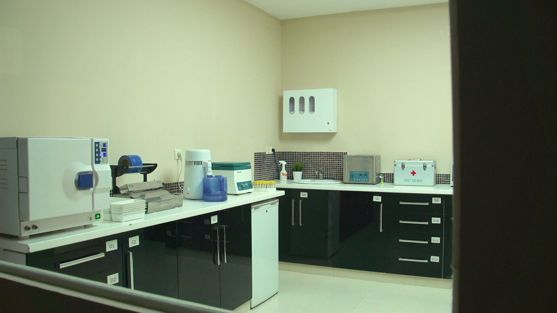 Sterilisation room with autoclave and instrument preparation area