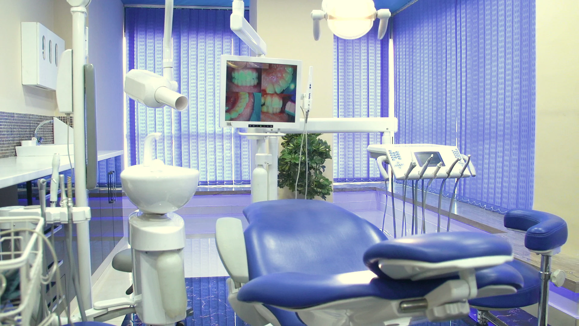 Treatment room with dental chair and intraoral camera screen